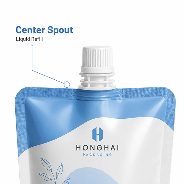 Close-up of a custom spout pouch with center spout for liquid refill packaging